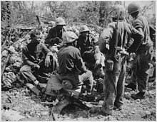 "17th Special" Seabees with the 7th Marines on Peleliu made national news in an official U.S. Navy press release. NARA-532537 "Group of CBs acting as stretcher bearers for the 7th Marines. Peleliu.", 09-1944 - NARA - 532537.jpg