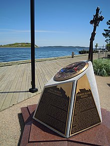 Monument to Imprisoned Acadians on Georges Island (background), Bishops Landing, Halifax Acadian memorial Halifax.JPG
