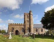 Stone building with central square tower.