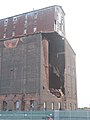 September 17, 2022 Saturday. This view shows the North face the day after demolition crews used a shear to rip apart one of the exposed metal bins.