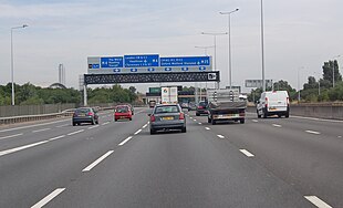 The M25 junction with the M4 with a gantry signposted to M4 The WEST.