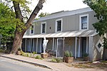 This dwelling-house has an interesting combination of vernacular and Georgian characteristics and dates from the mid-nineteenth century. The single-storey rear section probably pre-dates the original grant of land made in 1839. Previous use: residential. Current use: residential and commercial.