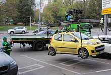 An improperly-parked car being recovered with a boom tow truck in Moscow. Tow truck in Moscow 04.jpg