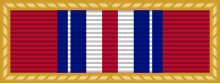 Width-44 Old Glory red ribbon surrounded by gold frame. The ribbon has a central width-3 Old Glory red stripe flanked by pairs of stripes that are respectively width-3 white, width-3 ultramarine blue, width one-half white and width-2 ultramarine blue.