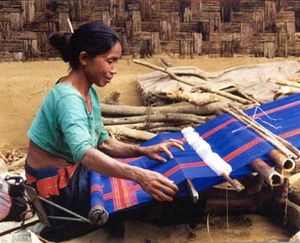 A  woman weaving. Textile work has historically been a female occupation in some cultures.