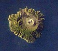 Barren Island— NASA photo showing island detail & volcanic plumes; annotated w direction & scale indicators; colour/contrast adjusted.