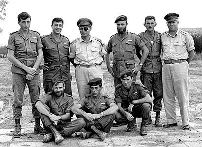 Moshe Dayan next to commanders of the Paratrooper Battalion 890, 1955.