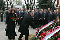 Vladimir Putin and his wife laying flowers on the grave