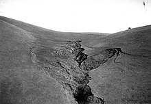 Headward erosion is demonstrated in this 1906 photo taken near Mount Tamalpais in Marin County, California. Groundwater sapping is causing this gully to lengthen up the slope. Headward erosion.jpg