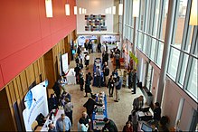 Larger conferences may have exhibits and displays for participants between sessions PhUSE Computational Science Symposium 2016 C 1089 (26340497691).jpg
