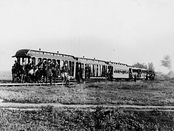 Group photo of passengers on the first train in the city which connected with Urbita Springs (LAPL 00032341, Works Progress Administration Collection)