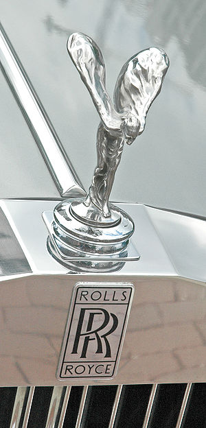 The RollsRoyce badge and Spirit of Ecstasy on the front of a