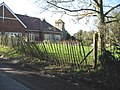 Stowting, new school building with church tower beyond.