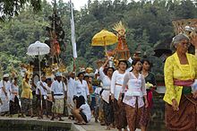 Procession with offerings entering a Hindu temple in Bali A procession with offerings entering a Hindu temple Bali.jpg
