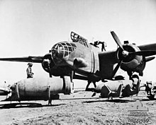 Douglas Boston Mk III bomber of 24 Squadron, South African Air Force, in Libya during the Western Desert campaign in June 1942. Bombing up SAAF Boston Libya June 1942 AWM MED0450.jpg