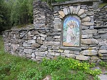 Mosaic embedded in stone wall, Italian area of Switzerland DryStoneArt.jpg