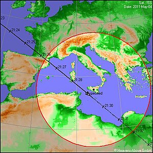 A ground track from Heavens-Above. An observer in Sicily can see the International Space Station when it enters the circle at 9:26 pm. A bright object appears in the northwest, crosses the sky to a point almost overhead, and disappears, in the span of three minutes. Heavens-Above Ground Track.jpg