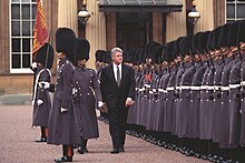 President Bill Clinton reviews honor guards at Buckingham Palace during a 1995 state visit to the UK. President Bill Clinton at Buckingham Palace.jpg