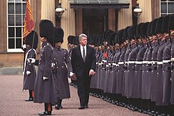 President Bill Clinton and Prince Philip inspect the Queen's Guard at Buckingham Palace, London, England (1995) President Bill Clinton at Buckingham Palace.jpg