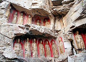Buddha statues in a cliff south of the Xingguochan Temple Qianfoshan buddha statues1.jpg