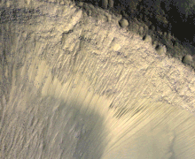 Images from HiRISE showing the appearance of dark marks on the floor of Valles Marineris. Images taken at various times in the year. Seasonal Changes in Dark Marks on an Equatorial Martian Slope.gif