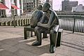 Two Men on a Bench, at Wren Landing, Canary Wharf, London