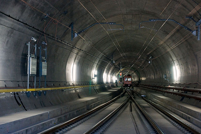 Ballastless track of the type "Low Vibration Track" with rails fastened to concrete ties/sleepers on a concrete slab in a turnout in the Gotthard Base Tunnel's Faido multifunction station.