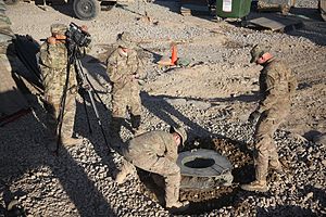 Ballast bags under a M120 mortar 3-10 Mountain sets up a mountain mortar firing system 131113-A-YX345-070.jpg