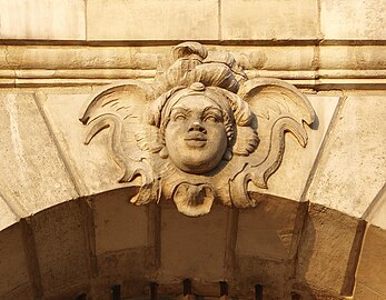 Rococo mascaron of an African woman in a cartouche on a building in the Place de la Bourse, Bordeaux, France, unknown architect and sculptor, 18th century