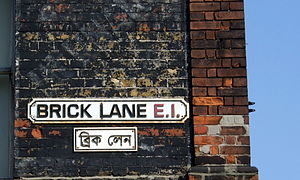 Street logo sign of Brick Lane in English and ...