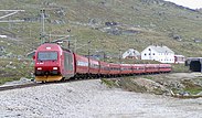 An El 18 hauled passenger train at Finse