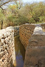 Stone walls of an irrigation channel