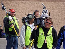 Fox Sports crew covering a NASCAR race Fox Sports Camera Crew at ACS.JPG