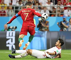 Ronaldo evades an Iran defender in the group stage of the 2018 World Cup. Portugal and Iran match at the FIFA World Cup 2018 9.jpg