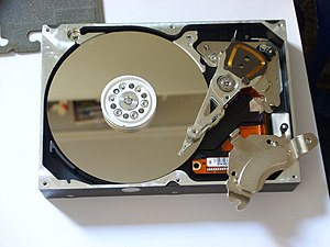 Opened hard drive with top magnet removed, sho...