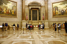 The National Archives' Rotunda for the Charters of Freedom where, in-between two Barry Faulkner murals, the original United States Declaration of Independence, United States Constitution, and other American founding documents are publicly exhibited. ArchivesRotunda.jpg