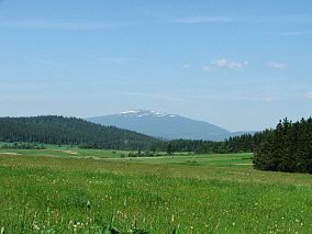 Vedere panoramică asupra masivului Babia Góra Logo-ul parcului Loc inclus în programul mondial al UNESCO „Omul și Biosfera” (MAB)