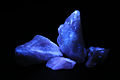 Calcite fluoresces blue under short wave ultraviolet light.