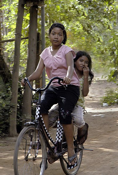 File:Cambodian girls on bicycle.jpg