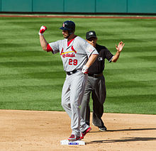 Carpenter flexes his surgically repaired arm and shoulder while on second base in NLDS Game 3, October 10, 2012. Chris Carpenter Muscle Flex.jpg
