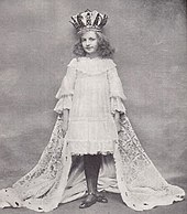 Maidie Andrews as Alice c. 1903 in the West End musical Alice in Wonderland Maidie Andrews Tatler 1904.jpg