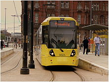 Metrolink in Manchester city centre, England, is an example of street-level light rail. Metrolink tram at Lower Moseley Street..jpg