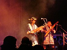The Oki Dub Ainu Band, led by the Ainu Japanese musician Oki, in Germany in 2007. Oki Ainu Dub Band at tff.Rudolstadt 2007.jpg