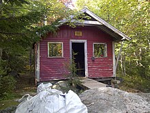 A red cabin in the forest