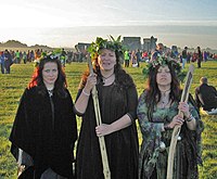 Three druidesses at Stonehenge on the morning ...