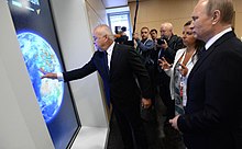 Putin and Russian state media propagandists Dmitry Kiselyov and Margarita Simonyan Vladimir Putin visited the Rossiya Segodnya International Information Agency (2016-06-07) 03.jpg