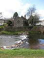 view of the church from across the River Monnow