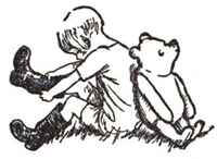 Christopher Robin and Winnie-the-Pooh seated back-to-back