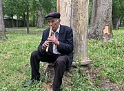 A shepherd from Polissia playing a sopilka "Dudka-vykrutka".