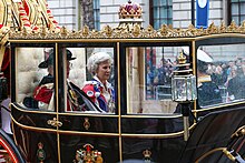 The Duke and Duchess riding in the Scottish State Coach with Vice Admiral Sir Timothy Laurence following the coronation on 6 May 2023 Coronation of Charles III and Camilla - Coronation Procession (68).jpg